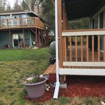 man leveling gravel for a walkway